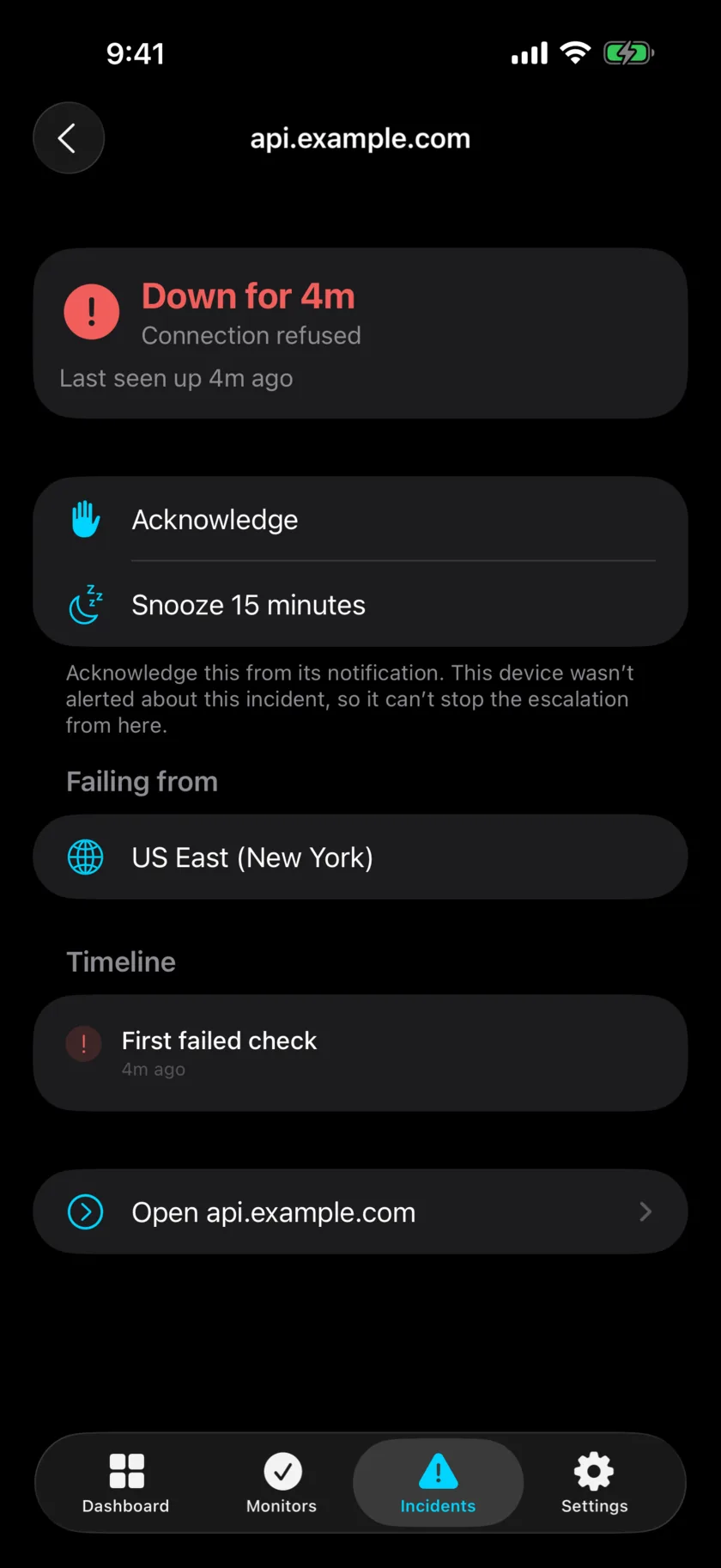 The iOS app showing an open incident for api.example.com: down for four minutes, connection refused, with Acknowledge and Snooze buttons and the timeline of the first failed check.